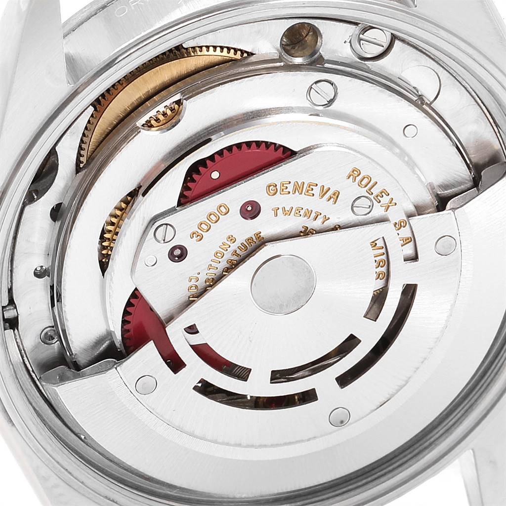 This close-up of the Rolex Air-King 14000 Men's Stainless Steel Silver Dial 14000 Men's Stainless Steel Silver Dial watch shows the internal movement and mechanical components.