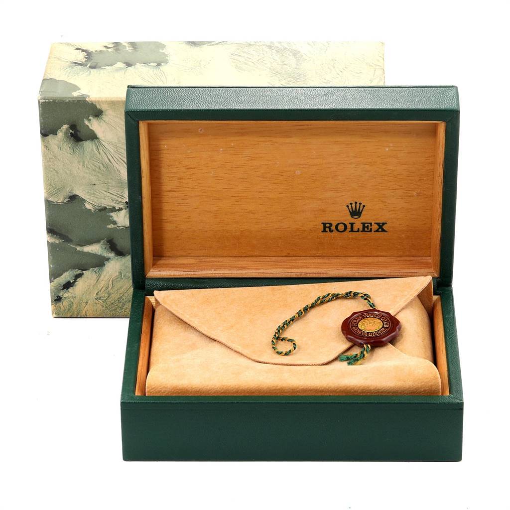 The image shows an open Rolex box with protective wrapping and a tag for the Air-King model inside.