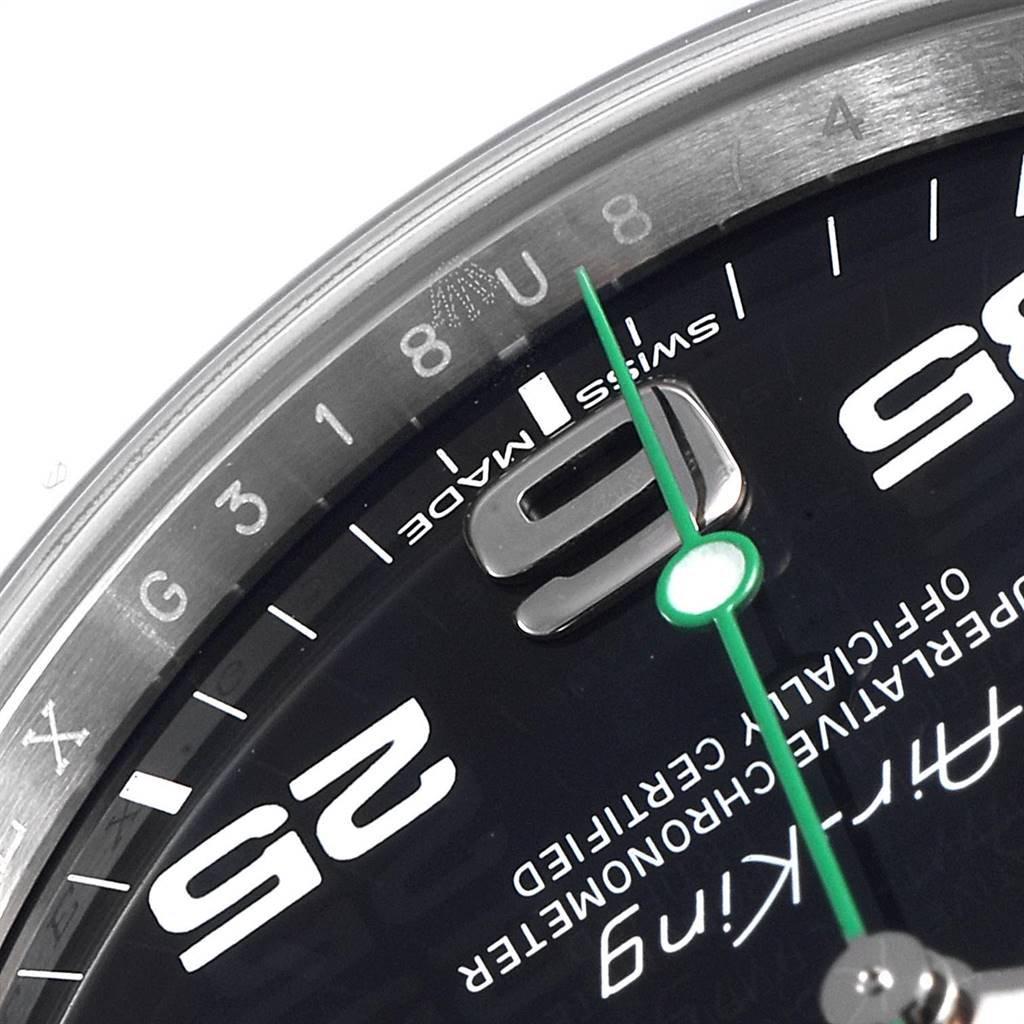This image of the Rolex Air-King 116900 Men's Stainless Steel Black Dial 116900 Men's Stainless Steel Black Dial watch shows a close-up of the dial, specifically the '9' and '3' indices, green second hand, and parts of the numerals.