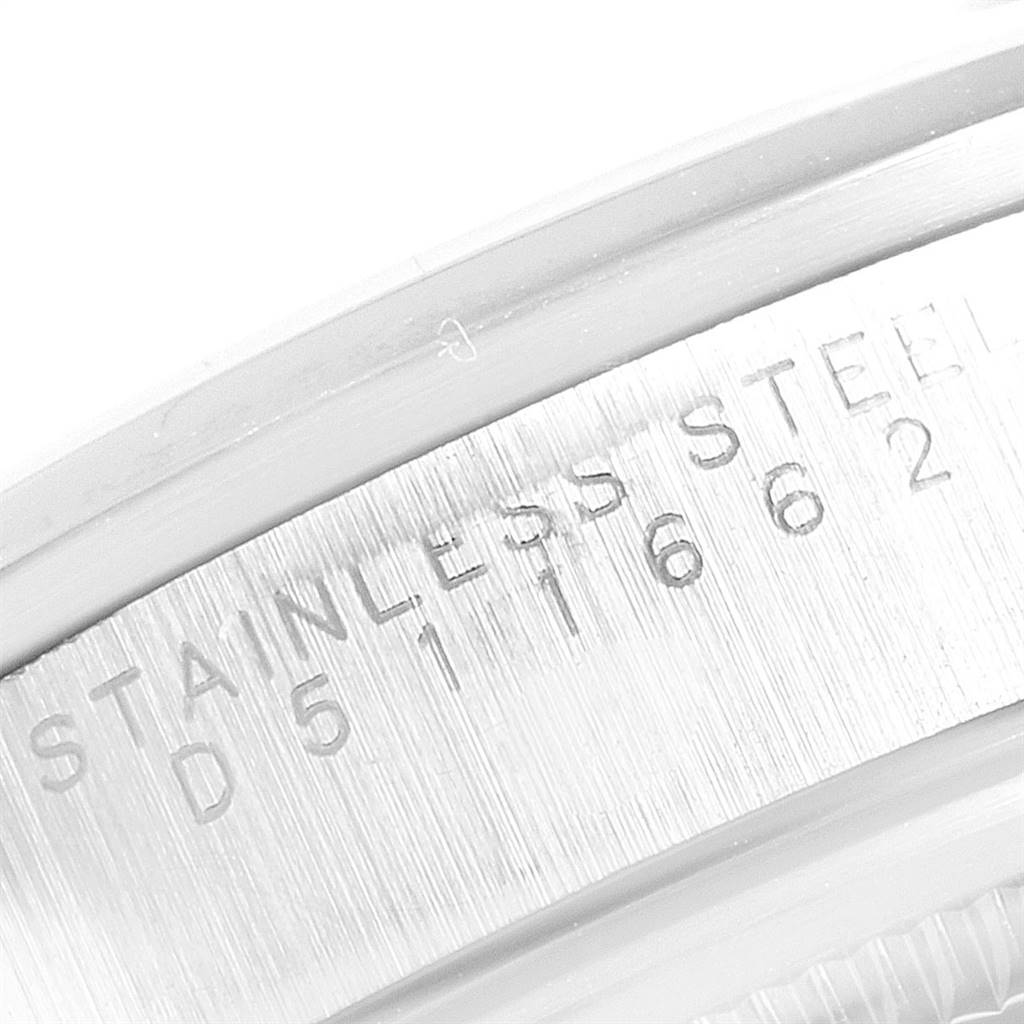 This close-up image shows the engravings on the case back of a Rolex Air-King 14000 Men's Stainless Steel Silver Dial 14000 Men's Stainless Steel Silver Dial watch, highlighting the stainless steel material and serial number.