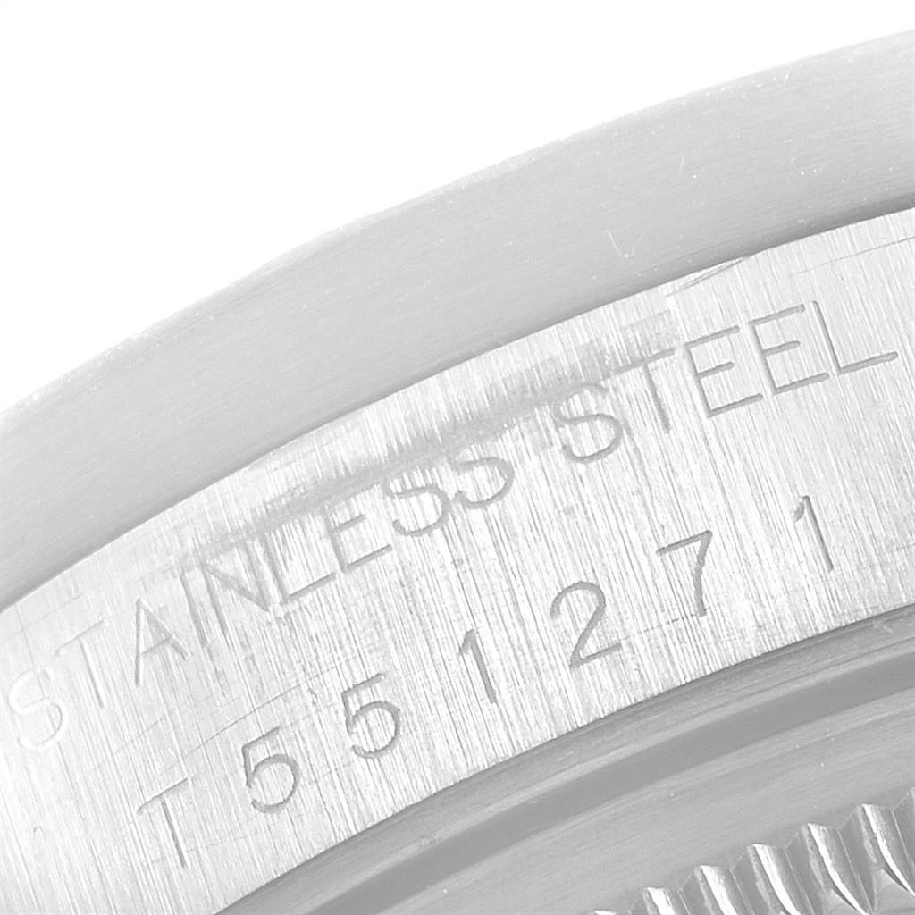 The image shows a close-up of the engraved stainless steel part of the Rolex Air-King 14010 Men's Stainless Steel White Dial 14010 Men's Stainless Steel White Dial watch with part of its serial or reference number.