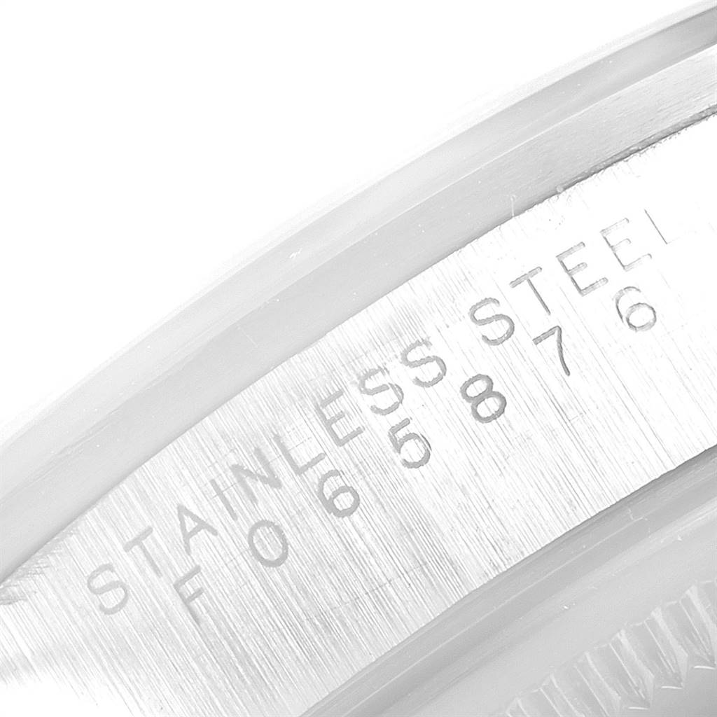This image shows a close-up of the serial number and "Stainless Steel" engraving inside the bezel of a Rolex Air-King 14000 Men's Stainless Steel Silver Dial 14000 Men's Stainless Steel Silver Dial watch.