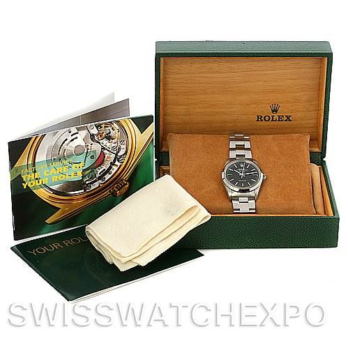 The image shows a Rolex Air-King 14000 Men's Stainless Steel Black Dial 14000 Men's Stainless Steel Black Dial watch at a front angle, placed inside its box, along with a booklet and a cleaning cloth.