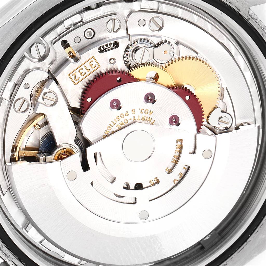 The image shows the internal mechanism of a Rolex Oyster Perpetual 114300 Men's Stainless Steel Silver Dial 114300 Men's Stainless Steel Silver Dial watch, focusing on the movement components.