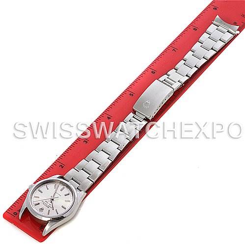 The Rolex Air-King 14000M Men's Stainless Steel Silver Dial 14000M Men's Stainless Steel Silver Dial watch is shown from a top-down angle, fully extended alongside a red ruler.