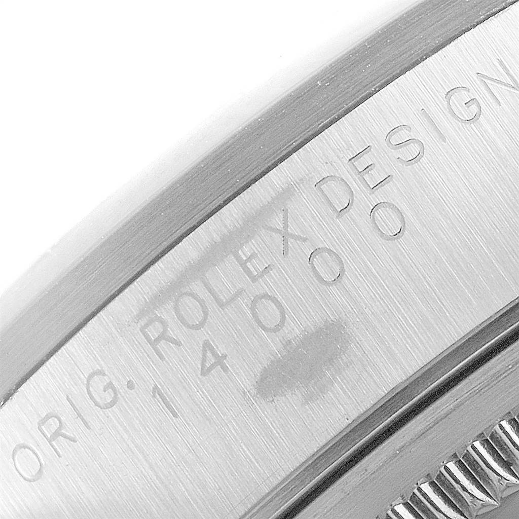 Close-up of the engraving on the case side of a Rolex Air-King 14000 Men's Stainless Steel White Dial 14000 Men's Stainless Steel White Dial watch, showing the model number and "Rolex Design."