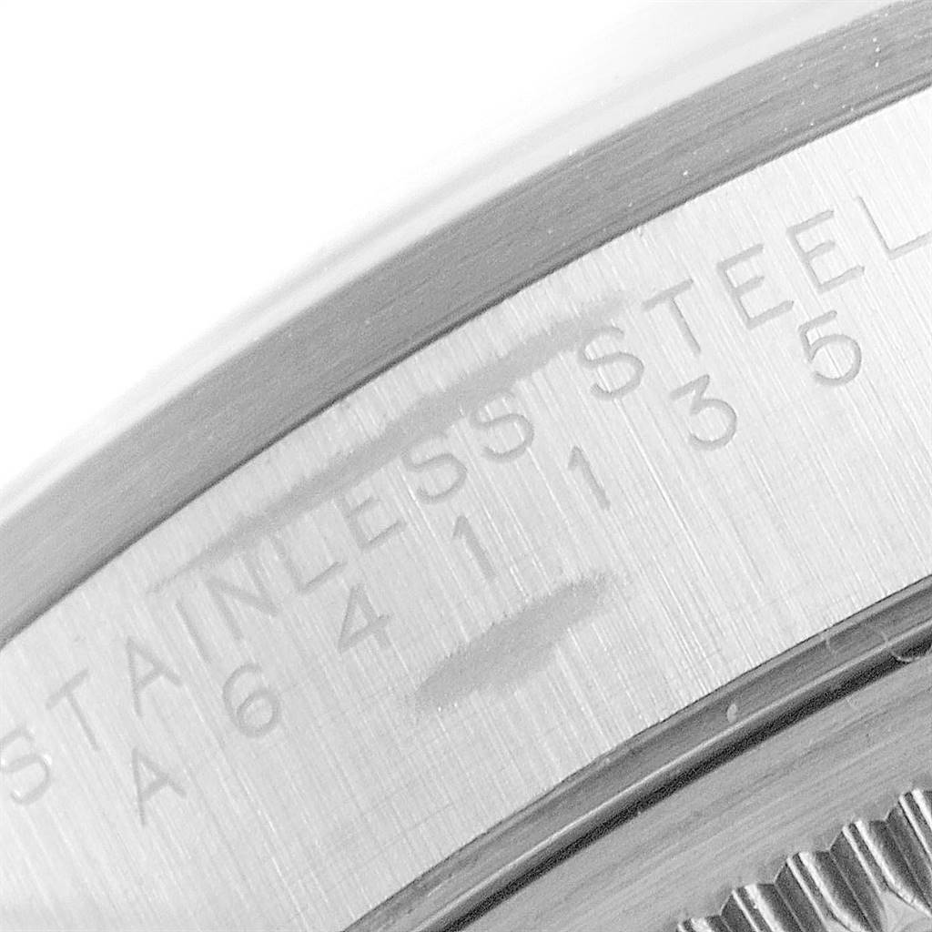 This close-up image shows the bezel and part of the case back of a Rolex Air-King 14000 Men's Stainless Steel White Dial 14000 Men's Stainless Steel White Dial watch, highlighting the "STAINLESS STEEL" engraving.