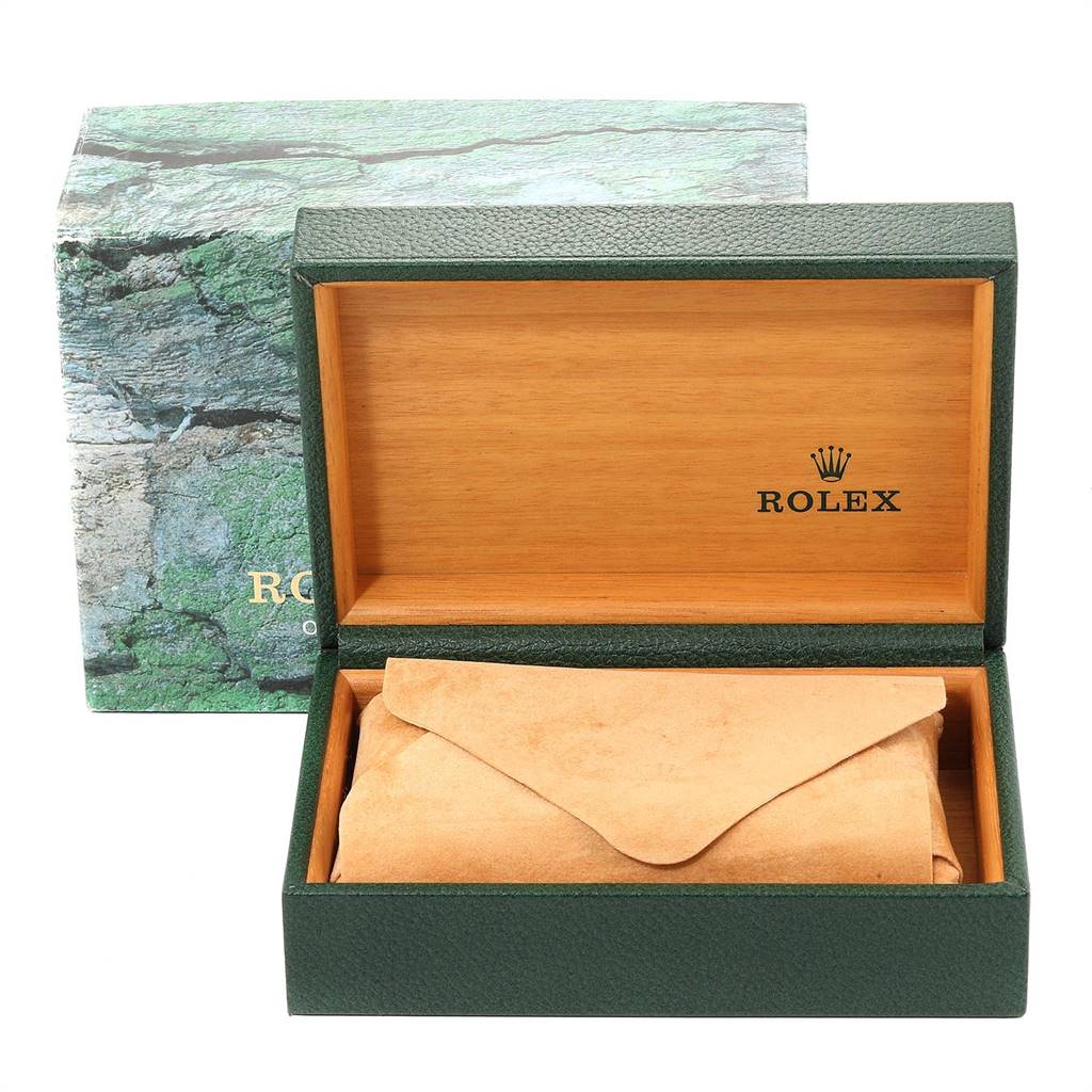 This image shows an open Rolex Air-King 14000 Men's Stainless Steel White Dial 14000 Men's Stainless Steel White Dial watch box with a green exterior, wooden interior, and a beige protective pouch inside.