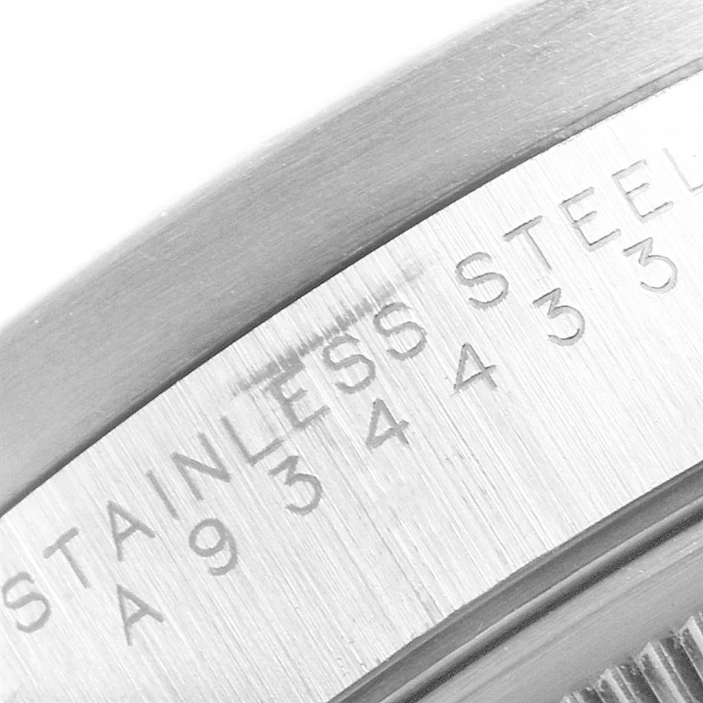 The image shows a close-up view of the stainless steel back case of a Rolex Air-King 14010 Men's Stainless Steel Black Dial 14010 Men's Stainless Steel Black Dial watch, focusing on the engraved text.