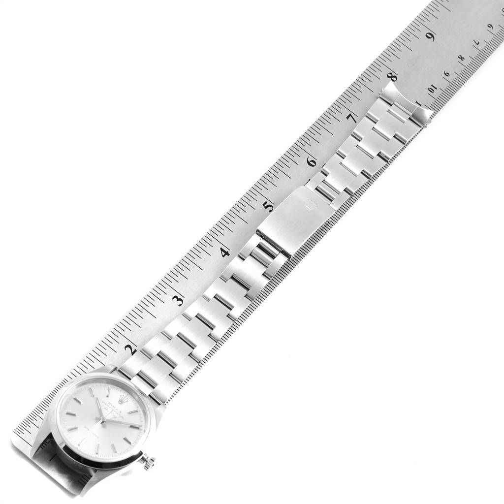 The Rolex Air-King 14000 Men's Stainless Steel Silver Dial 14000 Men's Stainless Steel Silver Dial watch is shown at an angle, highlighting the face and band, measured along a ruler.