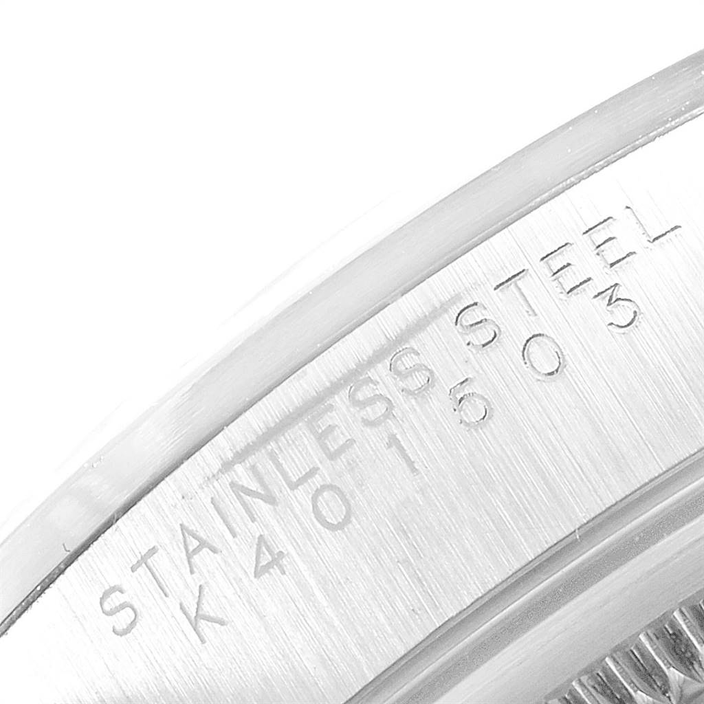 The image shows a close-up of the engraved stainless steel case side of a Rolex Air-King 14000 Men's Stainless Steel Silver Dial 14000 Men's Stainless Steel Silver Dial watch.