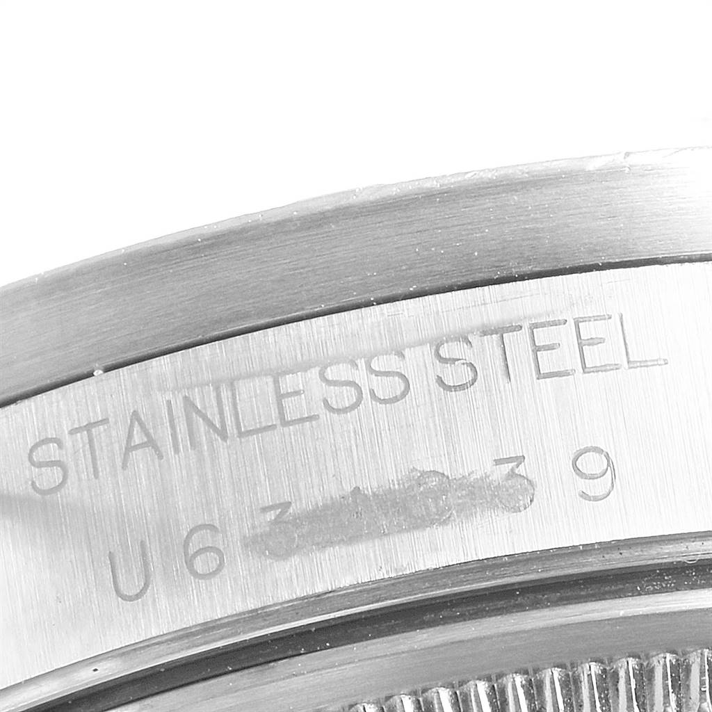 This close-up image shows the stainless steel casing and serial number engraving on a Rolex Air-King 14010 Men's Stainless Steel White Dial 14010 Men's Stainless Steel White Dial watch.