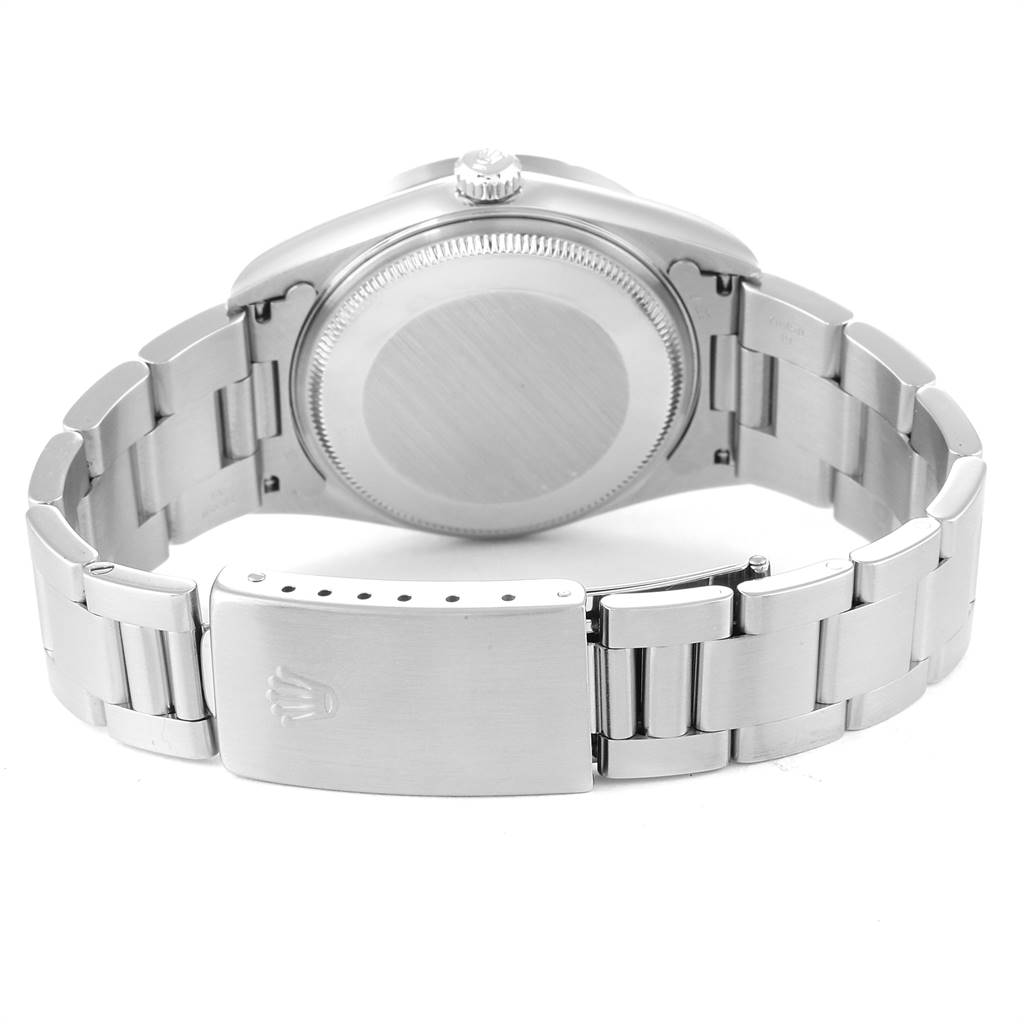 The Rolex Air-King 14010 Men's Stainless Steel White Dial 14010 Men's Stainless Steel White Dial watch is shown from the back, highlighting the caseback, bracelet, and clasp.