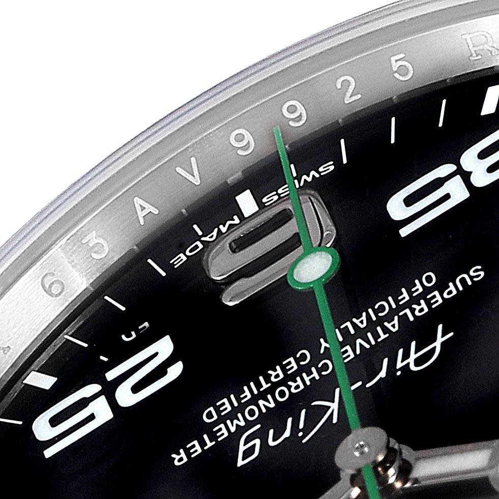 This close-up angle shows the dial details of a Rolex Air-King 116900 Men's Stainless Steel Black Dial 116900 Men's Stainless Steel Black Dial watch, including the minute marks and part of the green second hand.