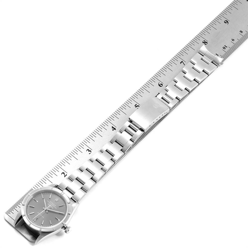 The image shows a Rolex Air-King 14010 Men's Stainless Steel Grey Dial 14010 Men's Stainless Steel Grey Dial watch laid flat alongside a steel ruler, displaying the watch case, dial, and the entire bracelet.