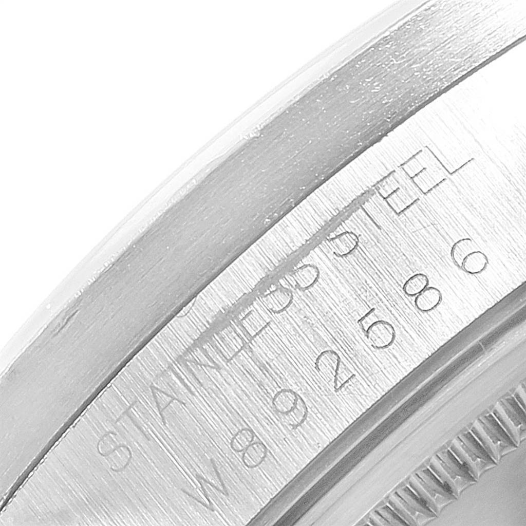 This is a close-up of the stainless steel casing of a Rolex Air-King 14010 Men's Stainless Steel Grey Dial 14010 Men's Stainless Steel Grey Dial watch, displaying its serial number.