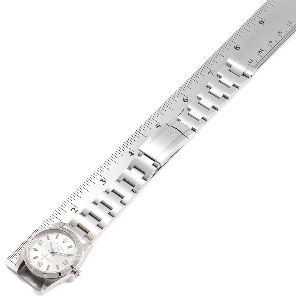 The image shows a Rolex Air-King 114210 Men's Stainless Steel Silver Dial 114210 Men's Stainless Steel Silver Dial watch and its stainless steel bracelet laid flat next to a ruler for measurement.