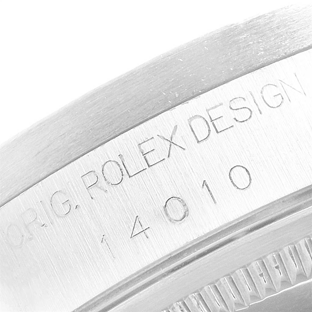 This image shows a close-up view of the engraved markings on the side of a Rolex Air-King 14010 Men's Stainless Steel Pink Dial 14010 Men's Stainless Steel Pink Dial watch case.