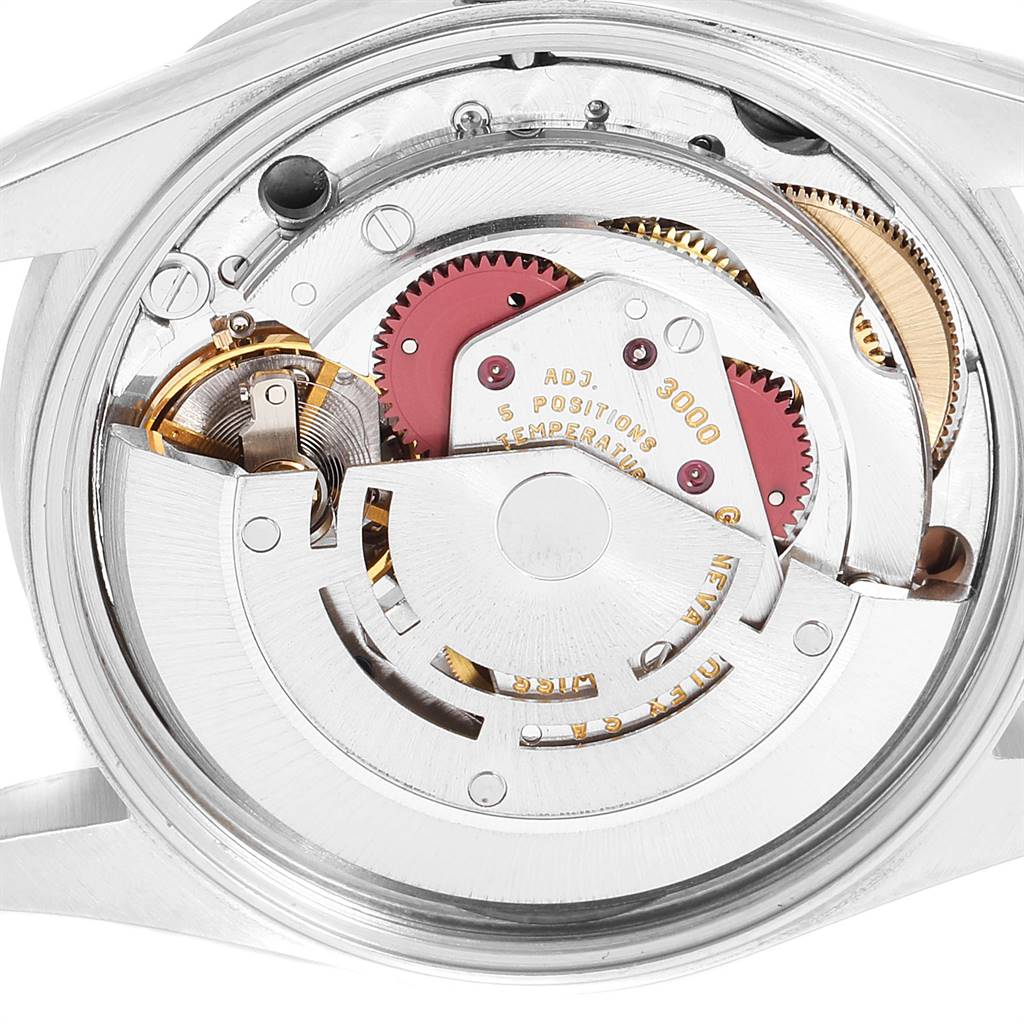 This image shows a close-up view of the internal mechanism of a Rolex Air-King 14010 Men's Stainless Steel Pink Dial 14010 Men's Stainless Steel Pink Dial watch, highlighting its intricate gears and components.