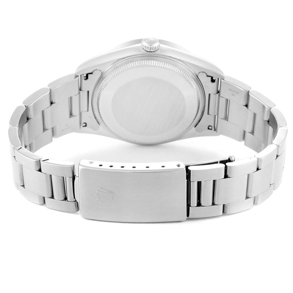 This image shows the back case and bracelet clasp of a Rolex Air-King 14010 Men's Stainless Steel Pink Dial 14010 Men's Stainless Steel Pink Dial watch.