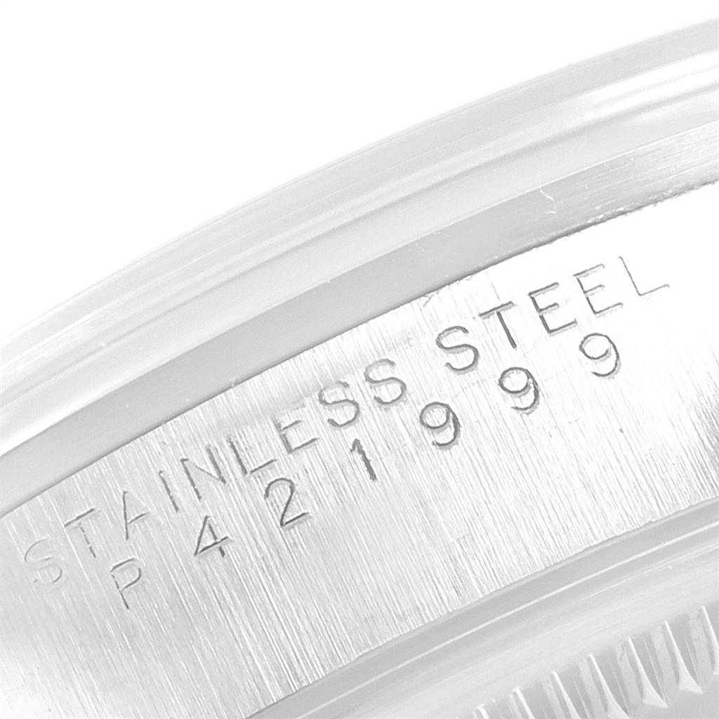 This close-up image shows the edge of the stainless steel caseback of a Rolex Air-King 14000 Men's Stainless Steel Silver Dial 14000 Men's Stainless Steel Silver Dial watch.