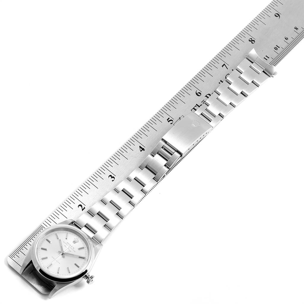 The image shows a Rolex Air-King 14000 Men's Stainless Steel Silver Dial 14000 Men's Stainless Steel Silver Dial watch laid flat beside a ruler, displaying the face, strap, and clasp.