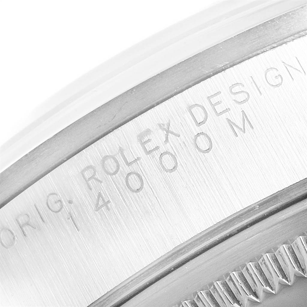 This close-up image shows the engraved edge of the case of a Rolex Air-King 14000 Men's Stainless Steel Silver Dial 14000 Men's Stainless Steel Silver Dial watch.