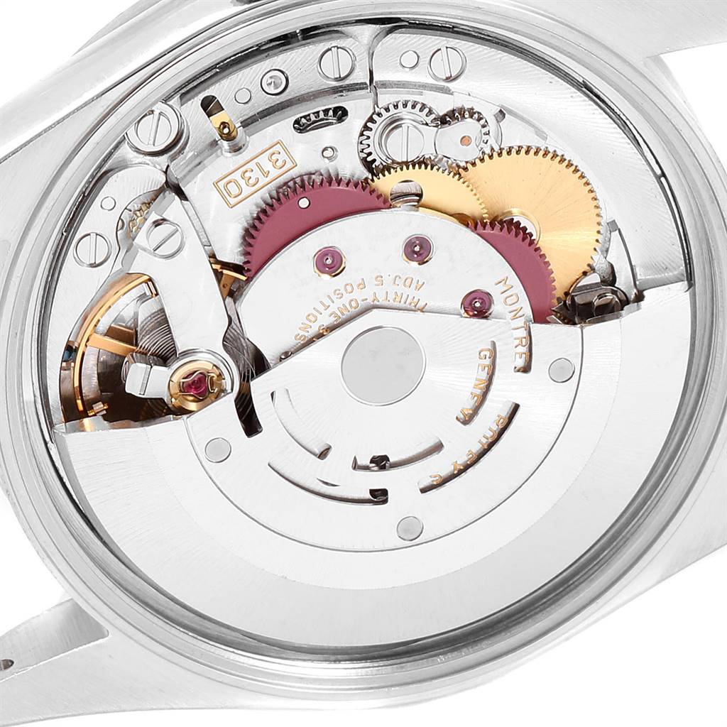 This image shows a close-up of the mechanical movement of a Rolex Air-King 14000 Men's Stainless Steel Silver Dial 14000 Men's Stainless Steel Silver Dial watch, highlighting its gears and components.