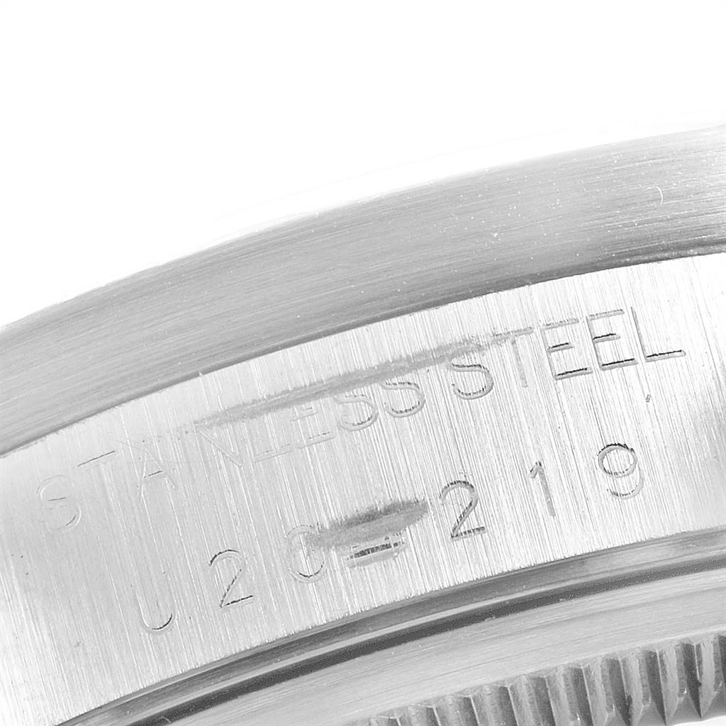 This close-up image shows the stainless steel casing of the Rolex Air-King 14010 Men's Stainless Steel Black Dial 14010 Men's Stainless Steel Black Dial model, focusing on the engraved text.