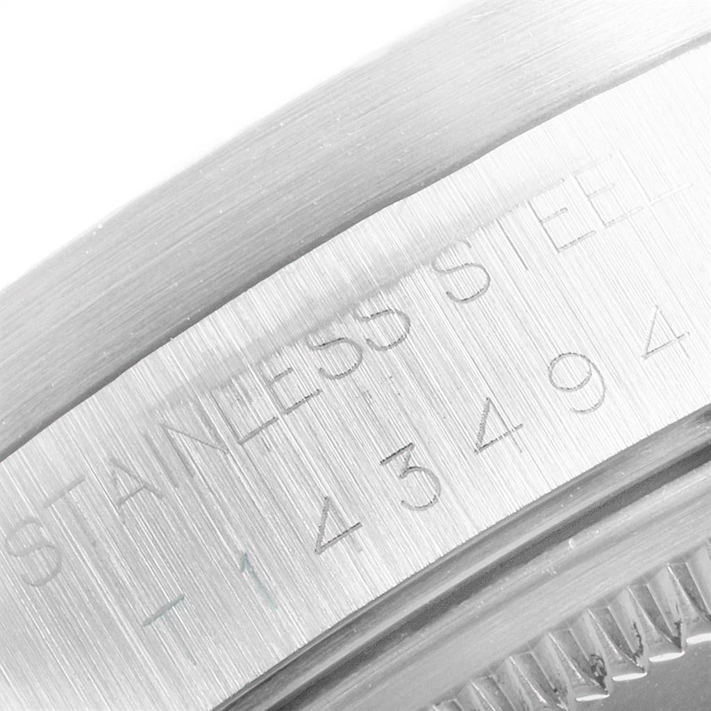 This image shows a close-up view of the stainless steel casing of the Rolex Air-King 14010 Men's Stainless Steel Black Dial 14010 Men's Stainless Steel Black Dial watch, detailing the engraved serial number.