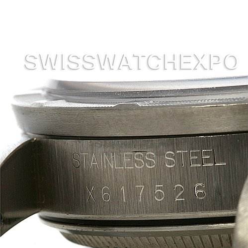 This image shows the side view of the Rolex Air-King 14010 Men's Stainless Steel Black Dial 14010 Men's Stainless Steel Black Dial watch case with the engraving "STAINLESS STEEL" and the serial number.