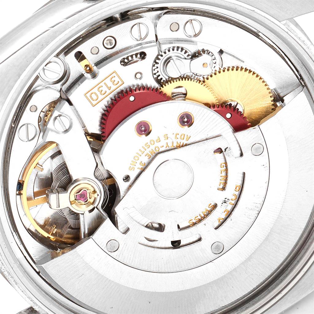 This image shows a close-up of the movement mechanism inside a Rolex Air-King 114234 Men's Stainless Steel Silver Dial 114234 Men's Stainless Steel Silver Dial watch, focusing on the gears and rotor.