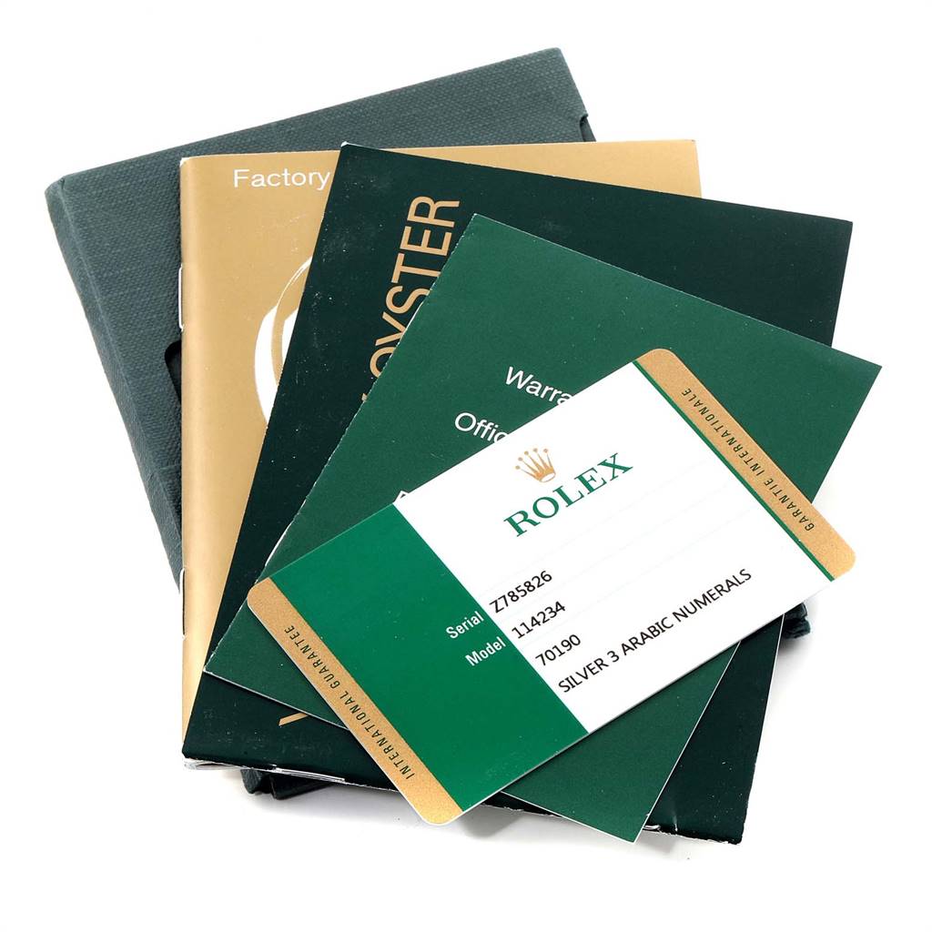 The image shows warranty and information cards along with booklets for the Rolex Air-King 114234 Men's Stainless Steel Silver Dial 114234 Men's Stainless Steel Silver Dial watch model.