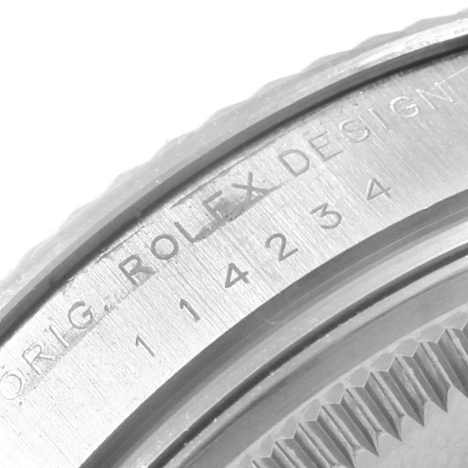 Close-up view of the bezel and engraving on the Rolex Air-King 114234 Men's Stainless Steel Silver Dial 114234 Men's Stainless Steel Silver Dial watch, highlighting the brand name and model number.