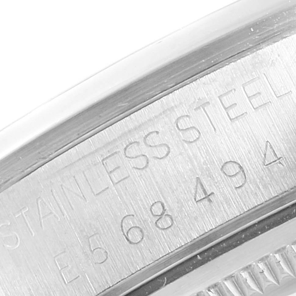 This image shows a close-up of the serial number and "STAINLESS STEEL" engraving on the caseback of a Rolex Air-King 14000 Men's Stainless Steel Black Dial 14000 Men's Stainless Steel Black Dial watch.
