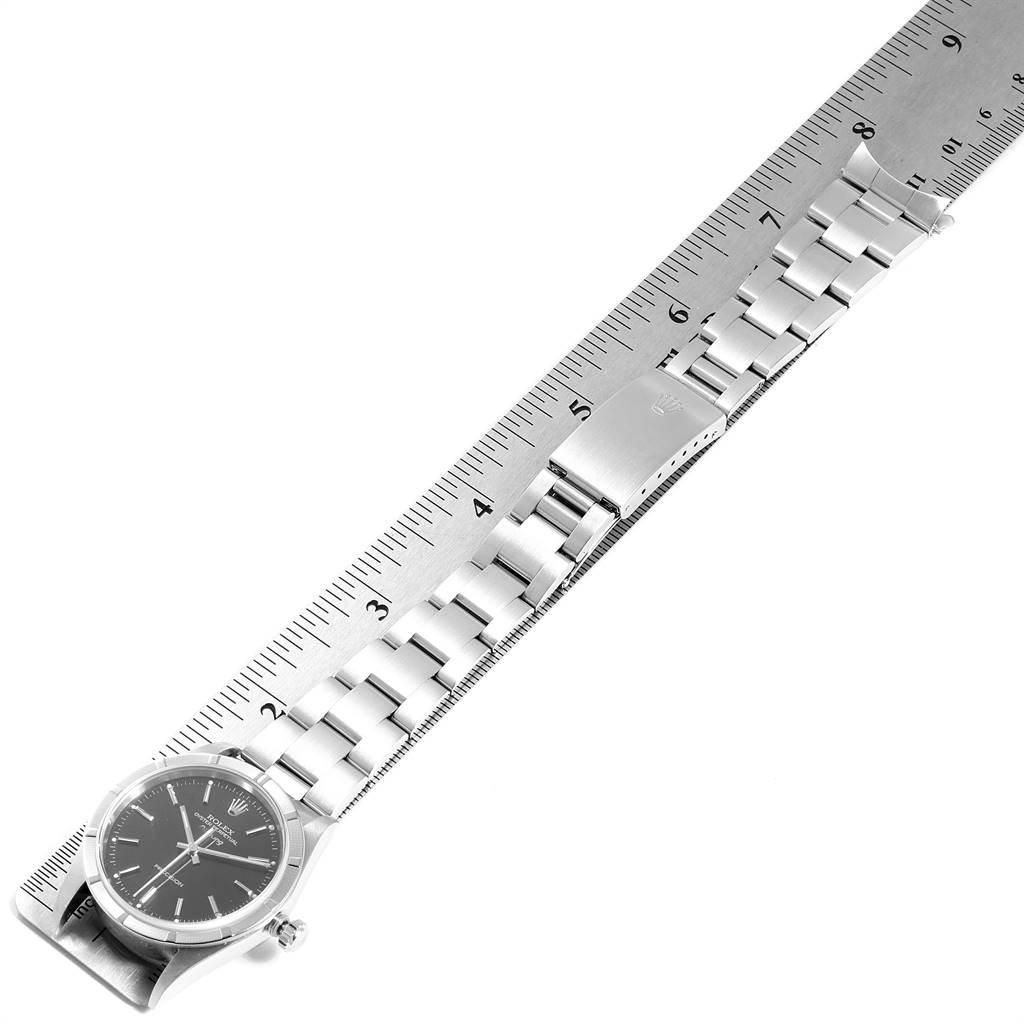 The image shows a side angle of a Rolex Air-King 14010 Men's Stainless Steel Black Dial 14010 Men's Stainless Steel Black Dial watch, focusing on the bracelet and clasp, aligned with a ruler.