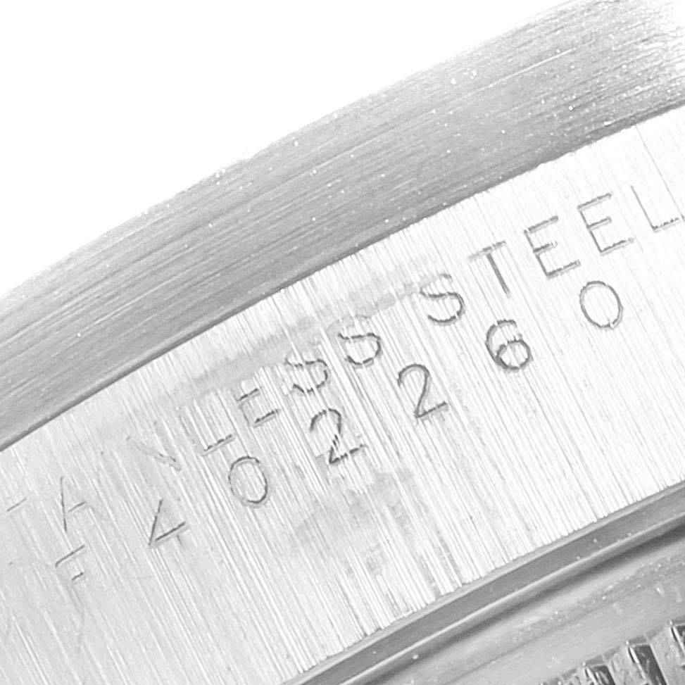 This close-up image shows the case back with engraved text "STAINLESS STEEL" of a Rolex Air-King 14010 Men's Stainless Steel Black Dial 14010 Men's Stainless Steel Black Dial watch.