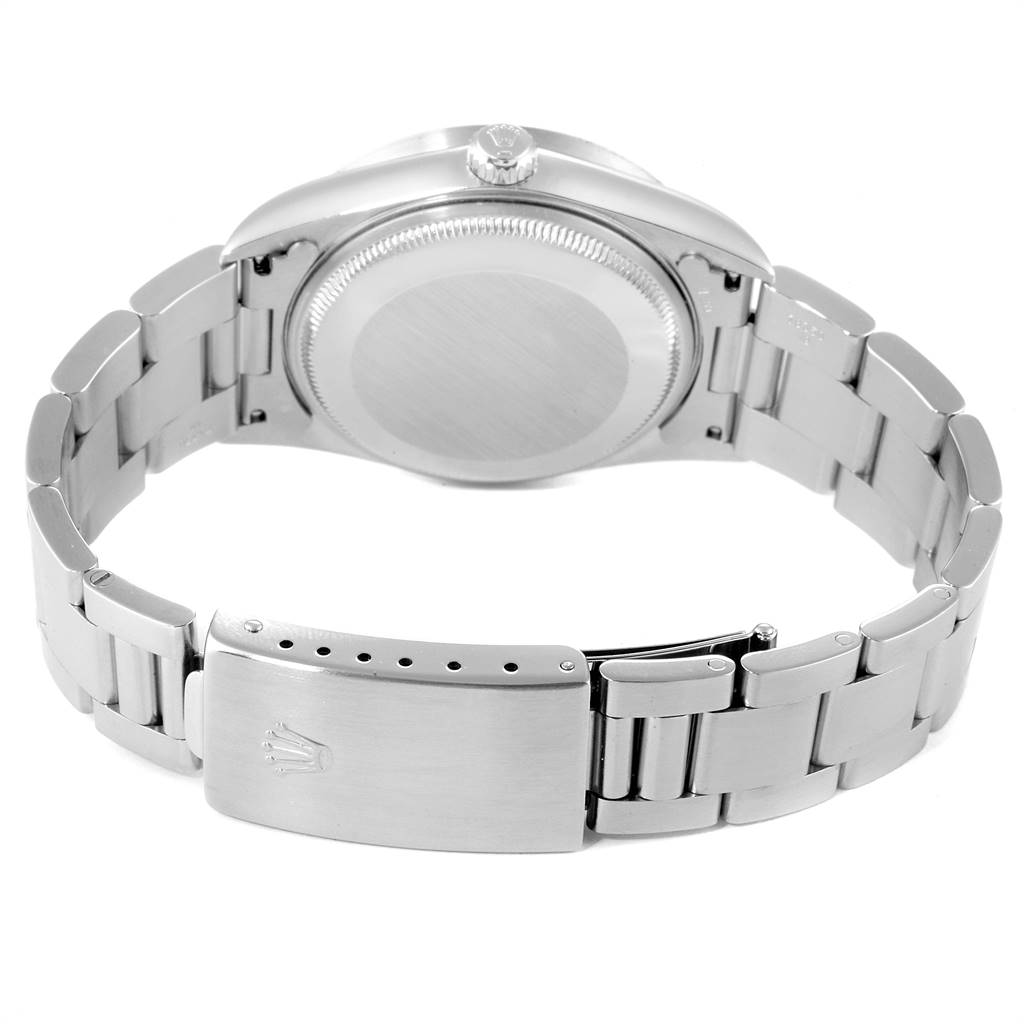 The image shows the back case, crown, and bracelet clasp of a Rolex Air-King 14010 Men's Stainless Steel Black Dial 14010 Men's Stainless Steel Black Dial watch at an angle.