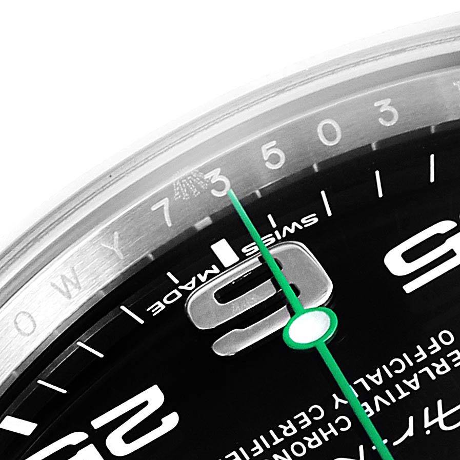 The image shows a close-up of the Rolex Air-King 116900 Men's Stainless Steel Black Dial 116900 Men's Stainless Steel Black Dial watch face, including the 9, 3, 5, and 7 numerals, and the minute hand.
