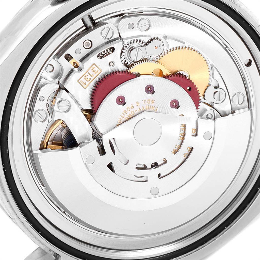 This image shows a close-up view of the internal mechanism of the Rolex Air-King 116900 Men's Stainless Steel Black Dial 116900 Men's Stainless Steel Black Dial watch, highlighting gears and components.