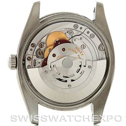 The image shows the back view of a Rolex Air-King 114200 Men's Stainless Steel White Dial 114200 Men's Stainless Steel White Dial watch, revealing its intricate movement and inner mechanism.