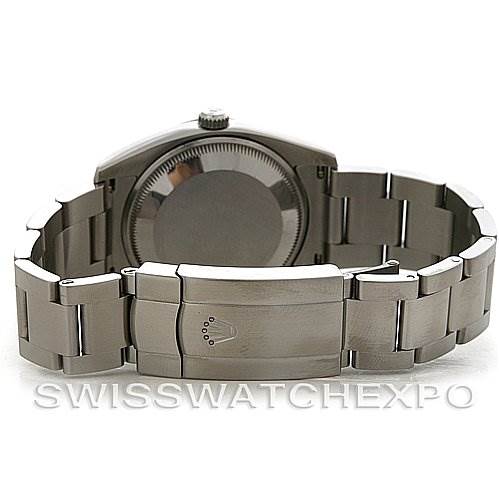 This image shows the Rolex Air-King 114200 Men's Stainless Steel White Dial 114200 Men's Stainless Steel White Dial watch from the back, highlighting the case back and metal bracelet.