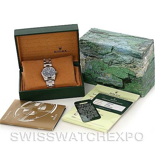The image shows the Rolex Air-King 14000 Men's Stainless Steel Blue Dial 14000 Men's Stainless Steel Blue Dial watch on a cushion in its open box, with the outer box, booklet, warranty card, and other documents.