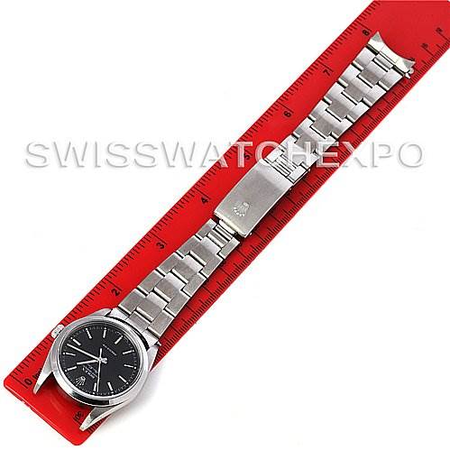 The image shows a top-down view of a Rolex Air-King 14000 Men's Stainless Steel Black Dial 14000 Men's Stainless Steel Black Dial watch placed alongside a red ruler.
