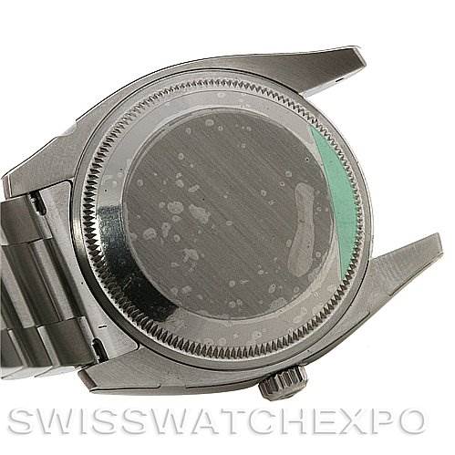 The image shows the back case of a Rolex Air-King 114200 Men's Stainless Steel White Dial 114200 Men's Stainless Steel White Dial watch from a rear angle, including parts of the bracelet and crown.