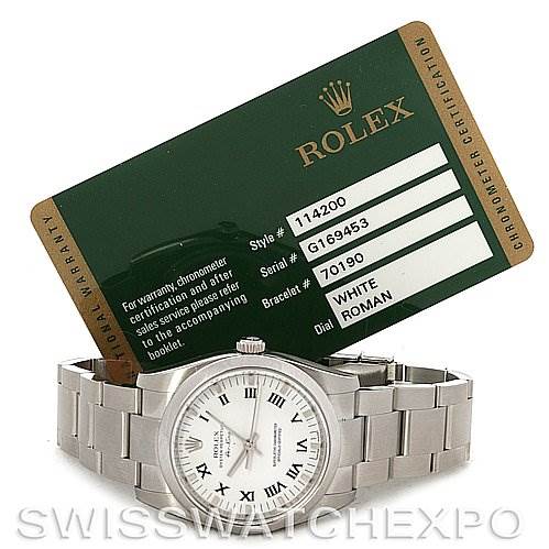 The image shows a Rolex Air-King 114200 Men's Stainless Steel White Dial 114200 Men's Stainless Steel White Dial watch, face up, with its steel bracelet; a Rolex certification card is displayed above the watch.