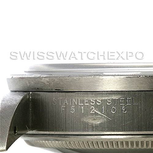 The image shows a close-up side angle of the case of a Rolex Air-King 14010 Men's Stainless Steel Blue Dial 14010 Men's Stainless Steel Blue Dial watch, with "STAINLESS STEEL" and a serial number engraved.