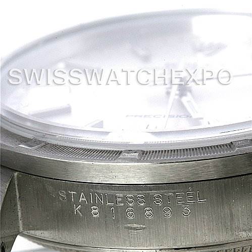 The image shows the side view of the Rolex Air-King 14010 Men's Stainless Steel Silver Dial 14010 Men's Stainless Steel Silver Dial watch, focusing on its stainless steel case and serial number engraving.