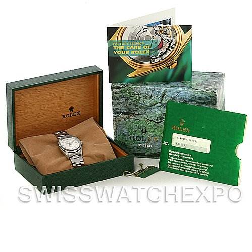 The image shows a Rolex Air-King 14010 Men's Stainless Steel Silver Dial 14010 Men's Stainless Steel Silver Dial watch at a slight angle inside its green and wooden box, with accompanying booklets and a tag.