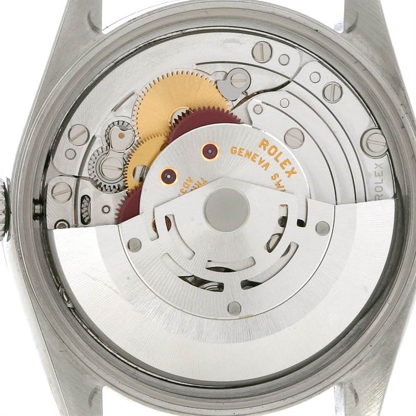 The image shows a close-up view of the internal mechanisms of a Rolex Air-King 14010 Men's Stainless Steel Silver Dial 14010 Men's Stainless Steel Silver Dial watch from the back angle.